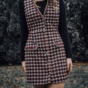 Jumper with one missing button